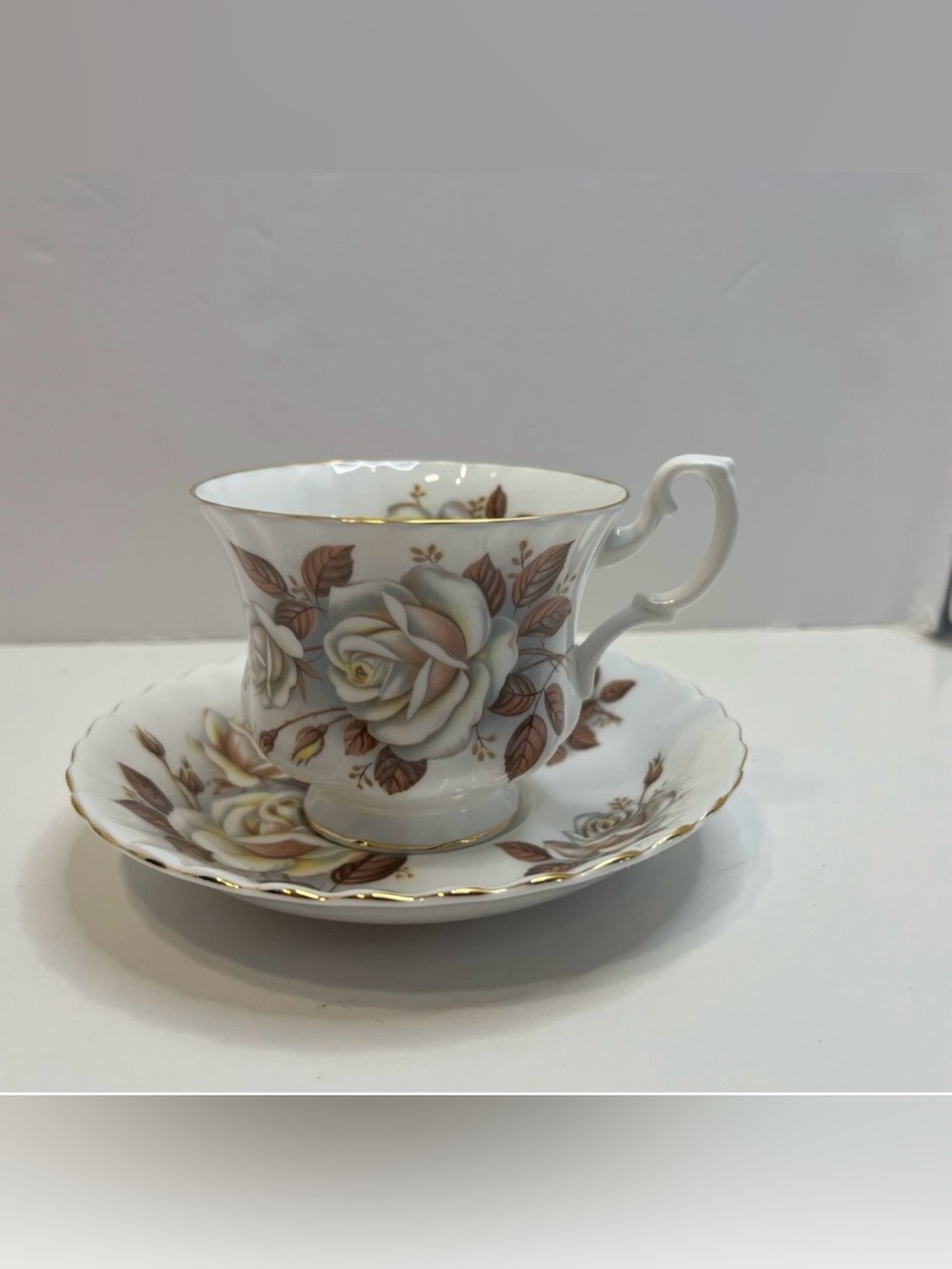 ROYAL ALBERT Floral footed tea cup and saucer bone china England